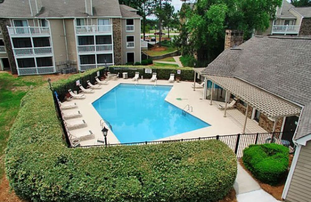Swimming pool surrounded by lounge chairs at Gable Hill Apartment Homes in Columbia, South Carolina