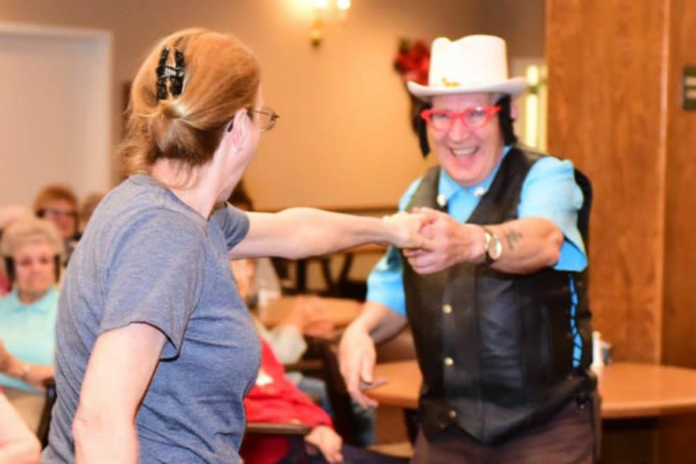 Resident dancing at a community event at River Commons Senior Living in Redding, California