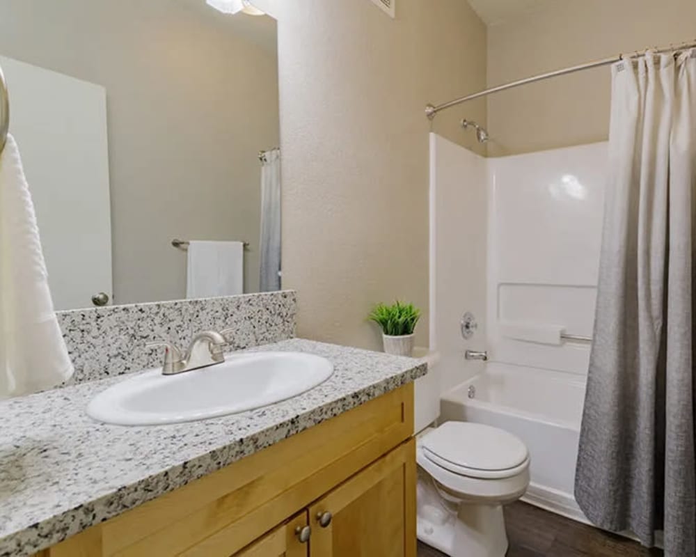 Bathroom with granite countertop at Seville at Mace Ranch in Davis, California