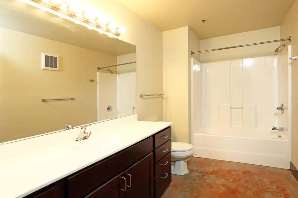White countertop with dark wood cabinetry at Rumely Lofts in Des Moines, Iowa