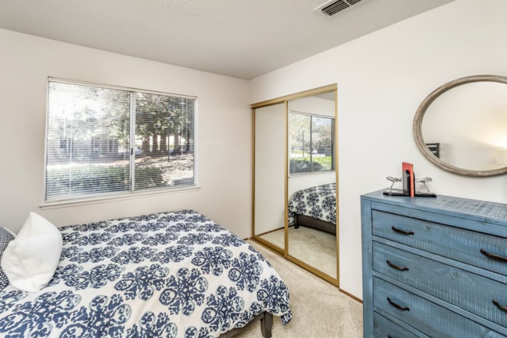Bedroom with windows at Cameron Oaks Apartment Homes in Cameron Park,California