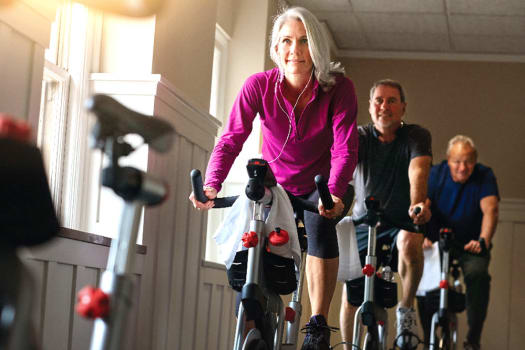 Residents in a spin class at The Alexander in Bend, Oregon