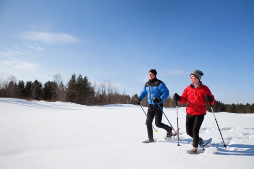 Snowshoeing couple near The Alexander in Bend, Oregon