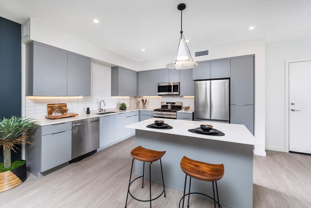 Model island kitchen with stainless-steel appliances and modern cabinetry at The Ellison in Las Vegas, Nevada