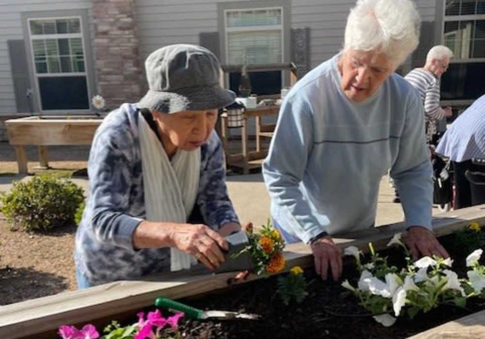 Residents gardening at Truewood by Merrill, Keller in Keller, Texas