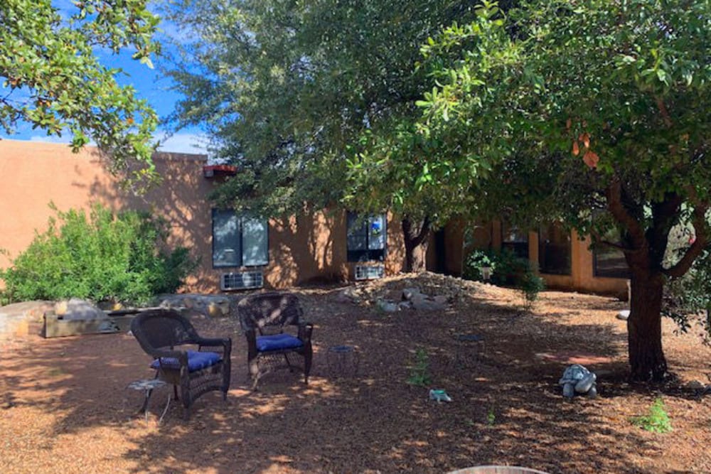 Seats by the trees at Desert Peaks Assisted Living and Memory Care in Las Cruces, New Mexico. 