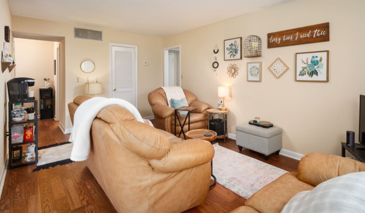 Wood-style flooring in an apartment living room at Ivy Green at the Shoals in Florence, Alabama