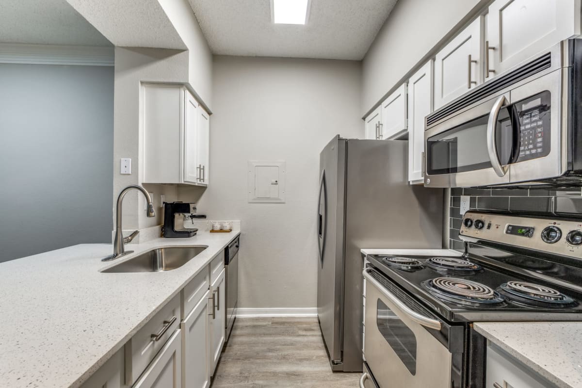 Apartment kitchen and living room at Montecito in Houston, Texas