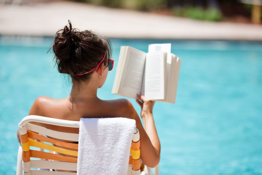 Swimming pool with a sundeck and chairs at EVR Porter in Maricopa, Arizona