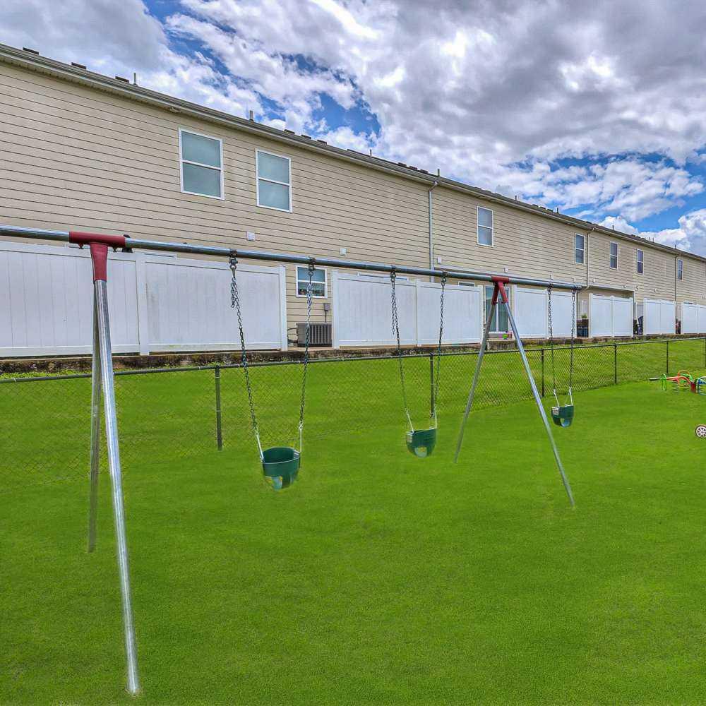 Playground with swings at Mill Springs Townhomes in Smyrna, Tennessee