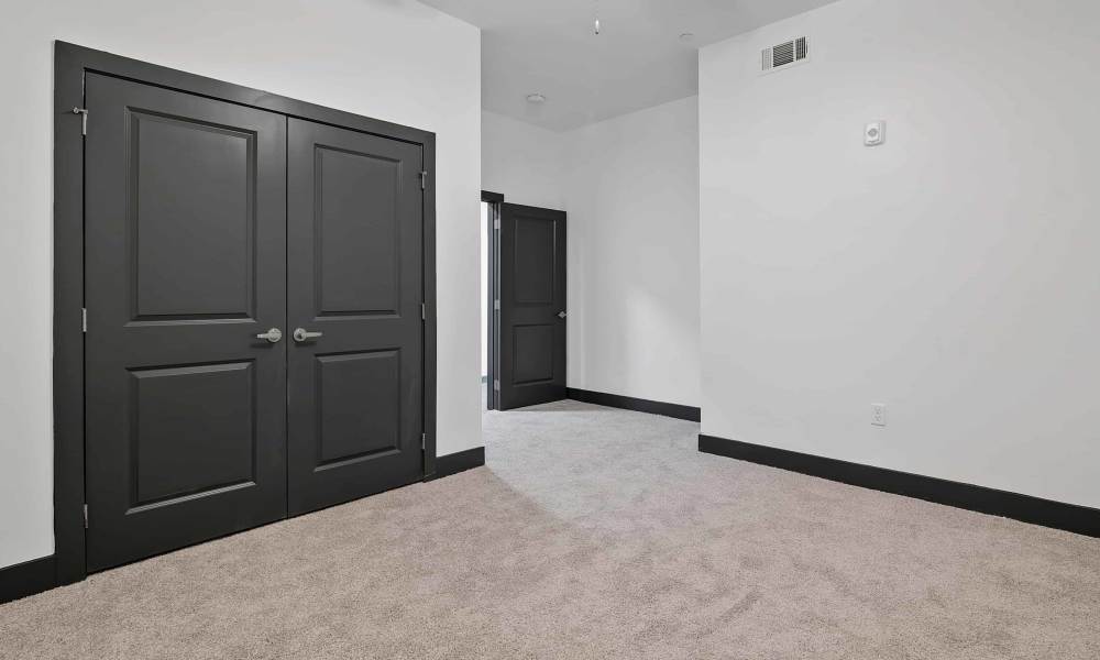 Bedroom with connecting rooms at The Lofts at the Municipal in Lafayette, Louisiana