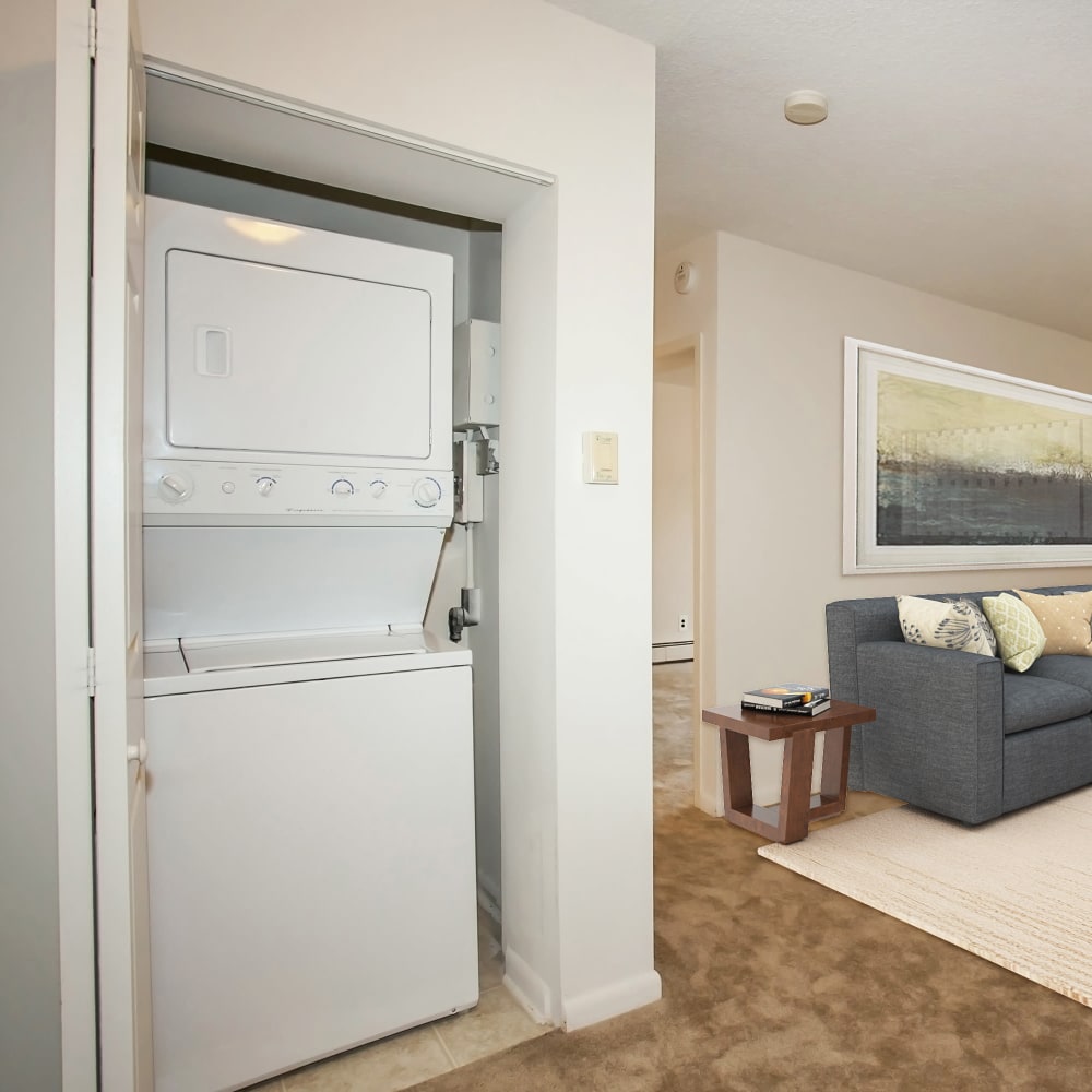 Living room with a washer and dryer in a home at Lexington House Apartment Homes in Cherry Hill, New Jersey