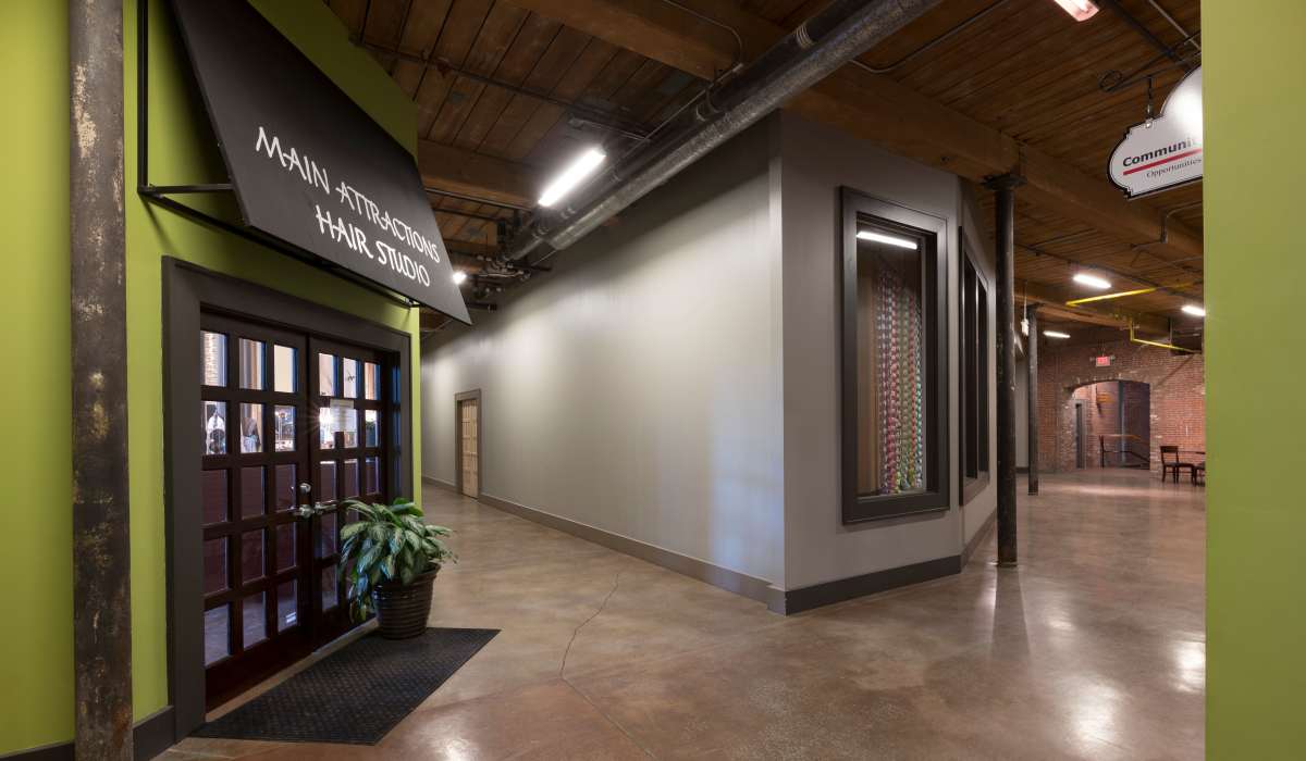 Garden style hair studio entrance with green walls at Commonwealth Landing Lofts in Fall River, Massachusetts