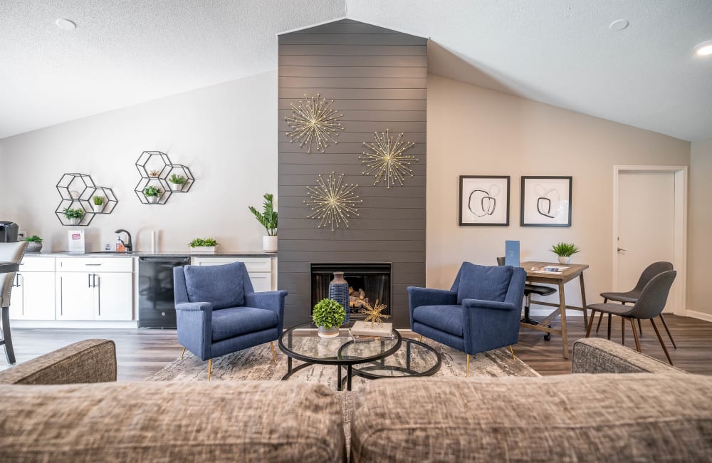 Living room with plank flooring in a model home at Kannan Station Apartment Homes in Kannapolis, North Carolina