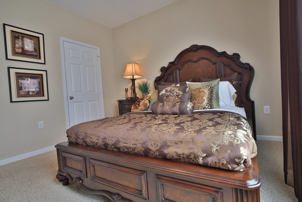 Inviting and cozy model bedroom at The Heights at McArthur Park in Fayetteville, North Carolina