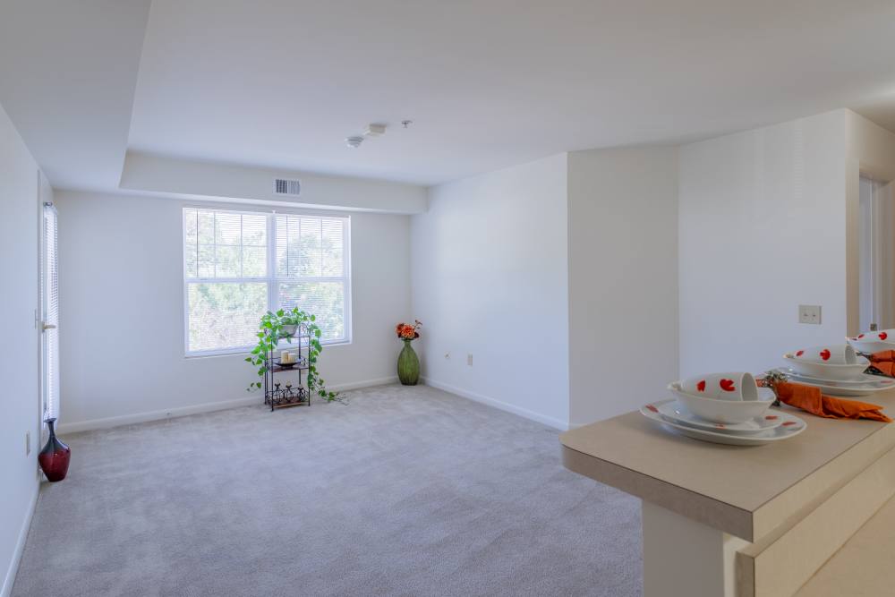 Unfurnished dining area with view to living room at Corrigan Square Apartments in Gaithersburg, Maryland