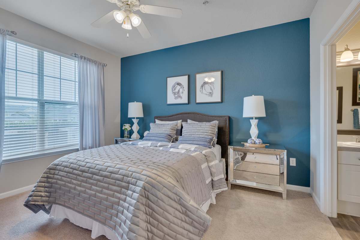 Master bedroom with king size bed and attached bathroom at Kildaire Reserve Apartments, Cary, North Carolina