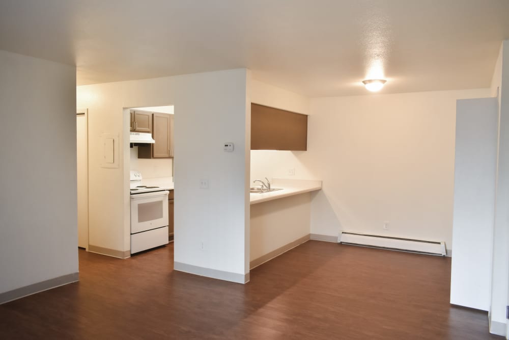Living room with connecting kitchen at Clairewood Apartments in Saint Clair, Michigan,