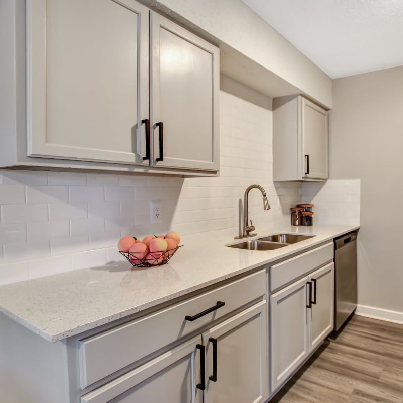 Beautiful kitchen with white cabinets at Lockhart Apartment Homes in Mesquite, Texas