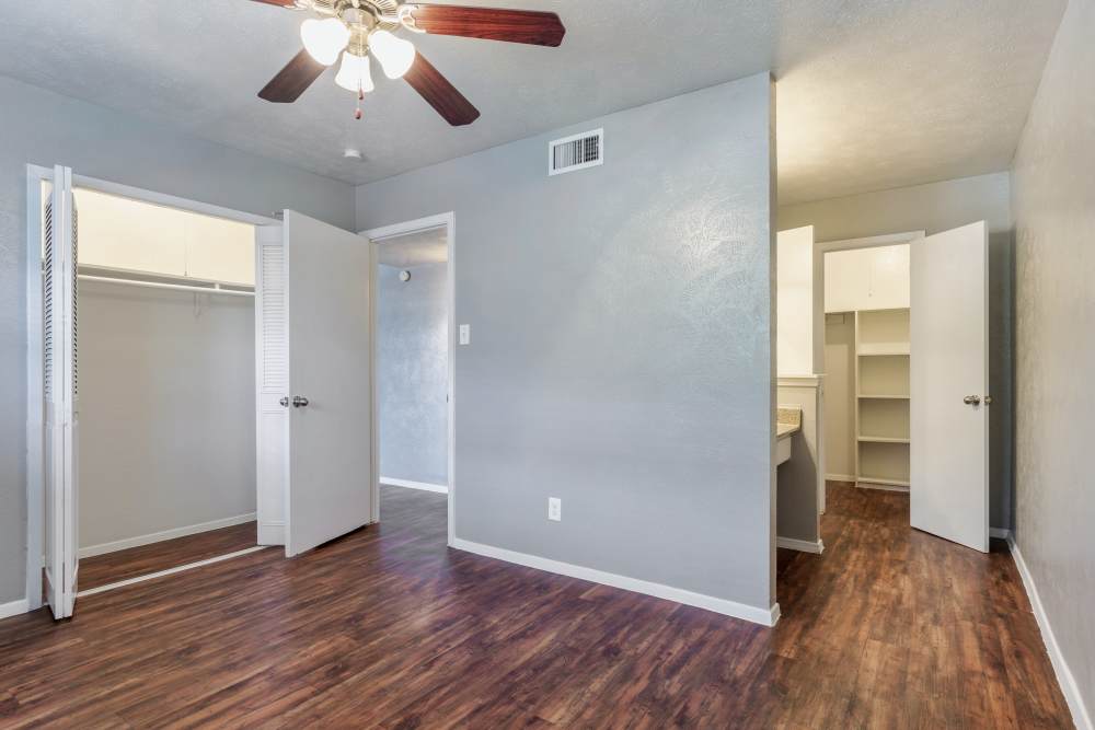 Bedroom with walk-in closet at Royal Arms in Richardson,Texas