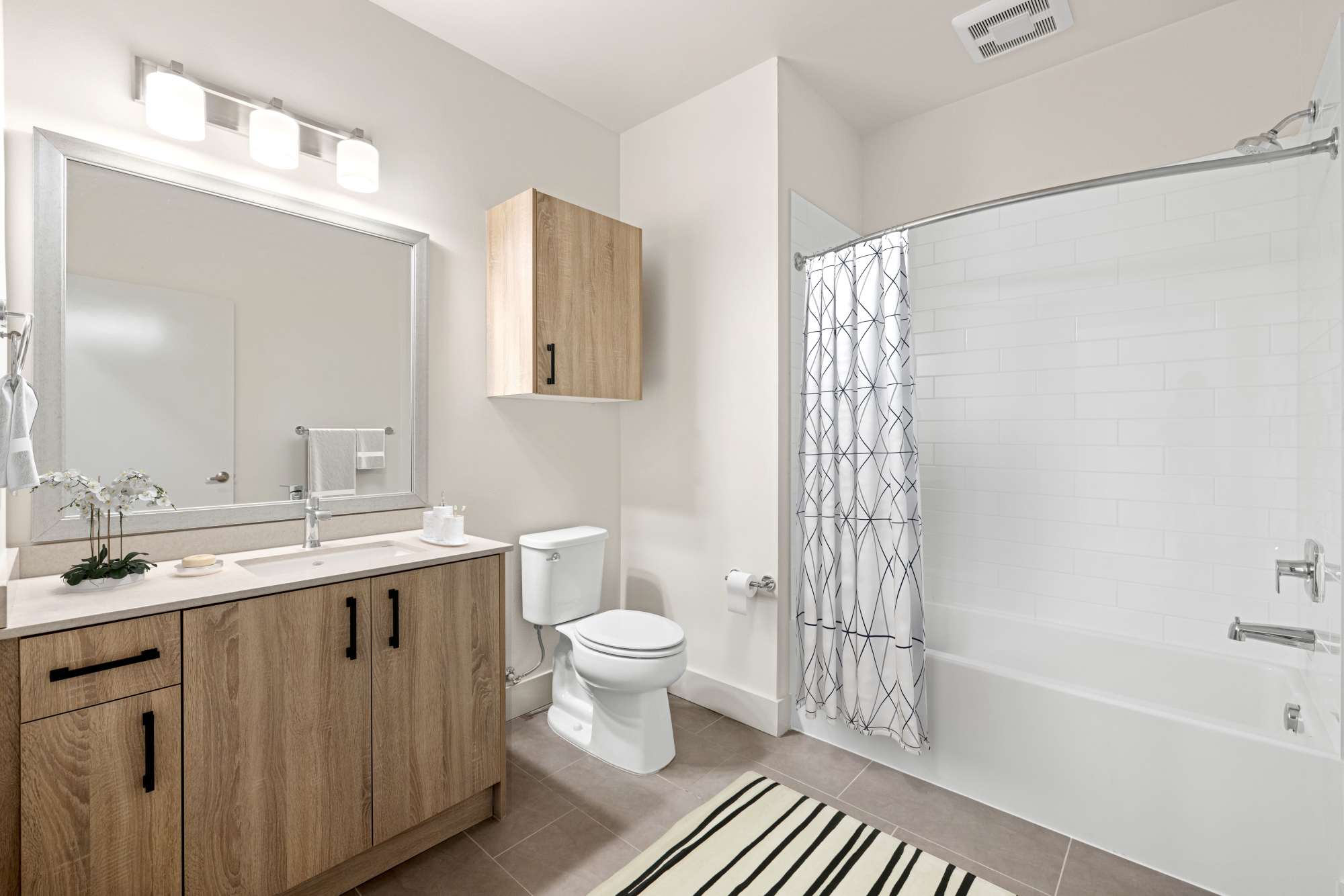 Bright bathroom with bath tub at Radiate in Redmond, Washington