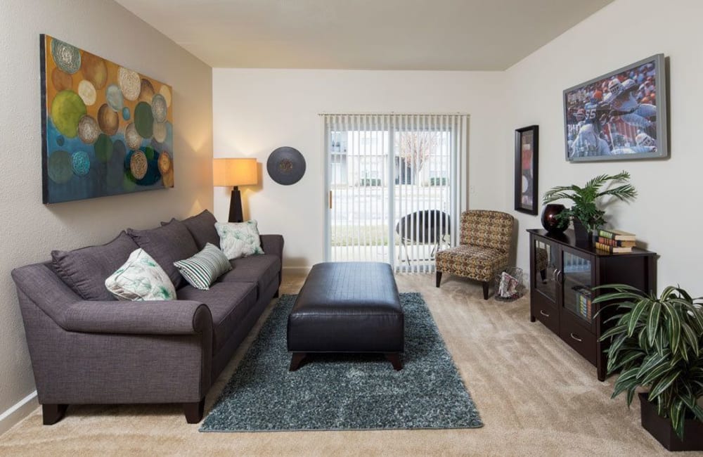 Living room with carpeting in a model home at Crescent at Wolfchase in Memphis, Tennessee