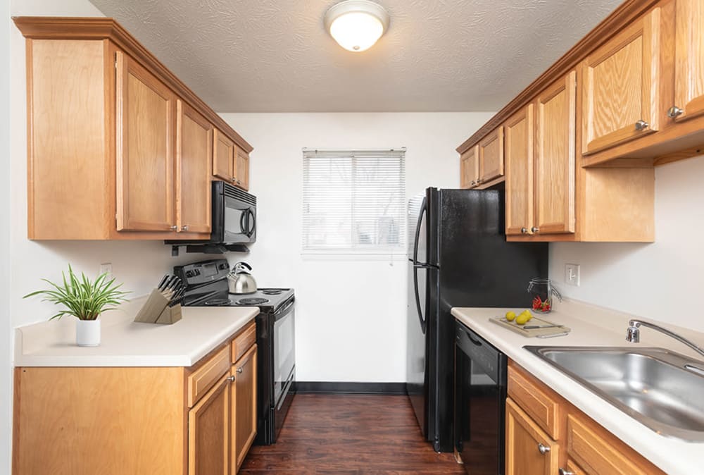 Fully-equipped kitchen at Waverlywood Apartments & Townhomes in Webster, New York