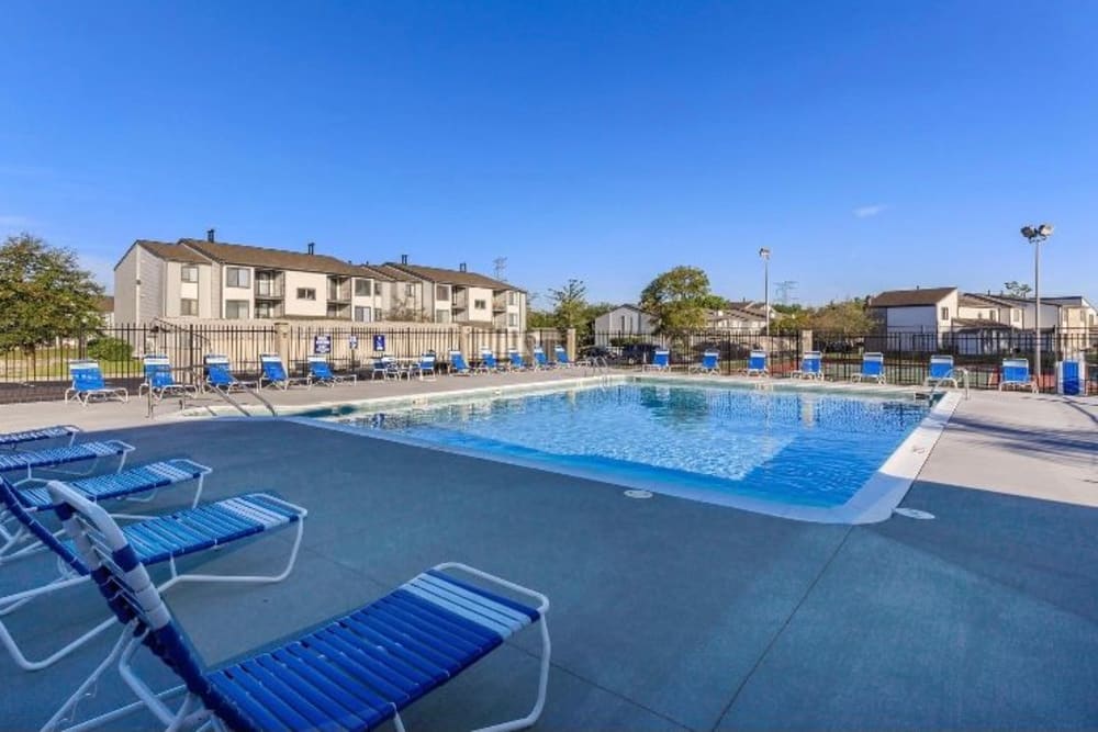 Swimming pool surrounded by lounge chairs at Lakeside Crossing at Eagle Creek in Indianapolis, Indiana