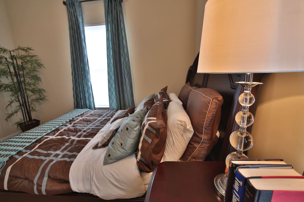 Cozy model bedroom at The Heights at McArthur Park in Fayetteville, North Carolina