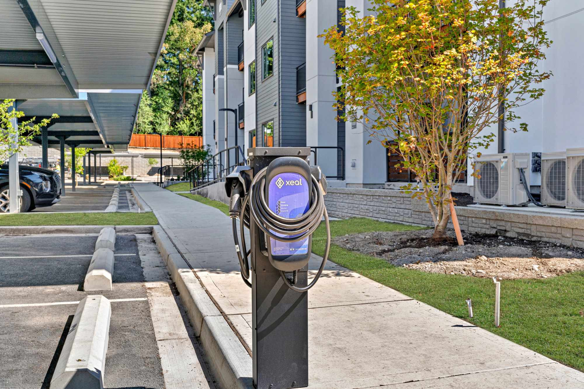 EV charging station and carport at The Highlands at Silverdale in Silverdale, Washington