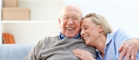 Resident hugging a young lady at The Creekside in Woodinville, Washington