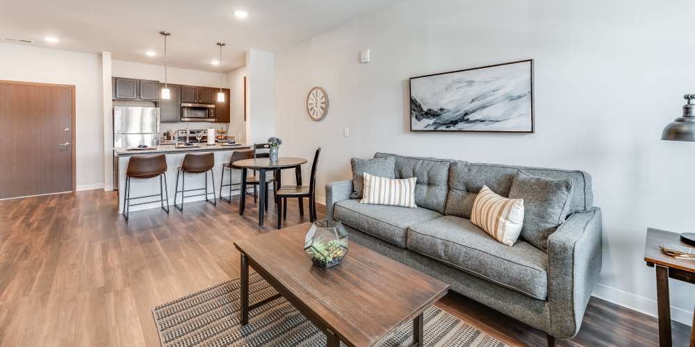 Spacious living room with a comfortable couch and a coffee table at Pike Ridge in Kenosha, Wisconsin