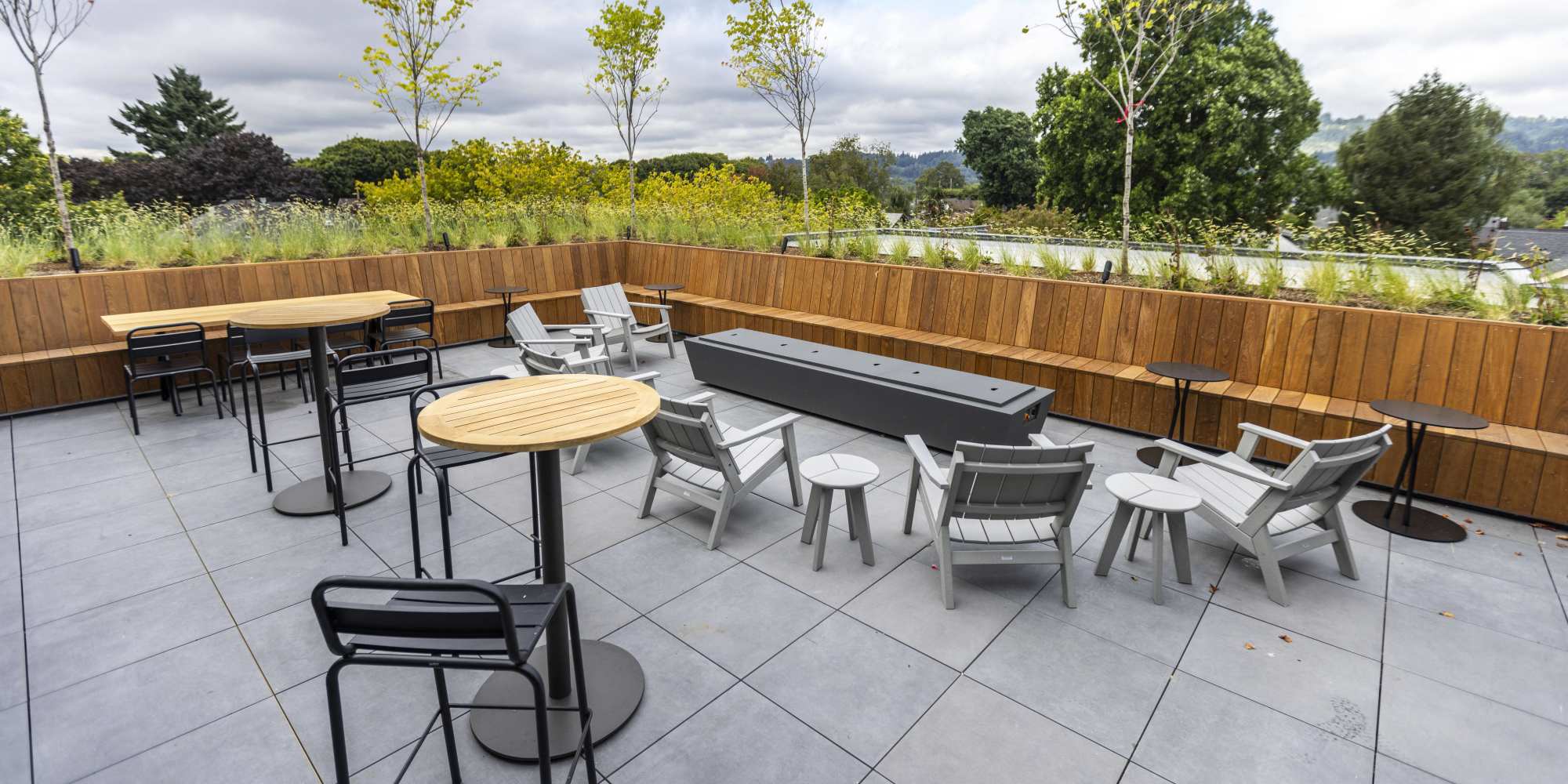 Outdoor lounge area with firepit at Brookland Apartments in Portland, Oregon