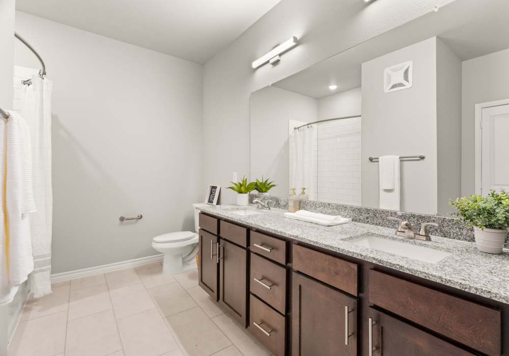 Bathroom with dual sink vanity  at Walnut Springs in Seguin, Texas
