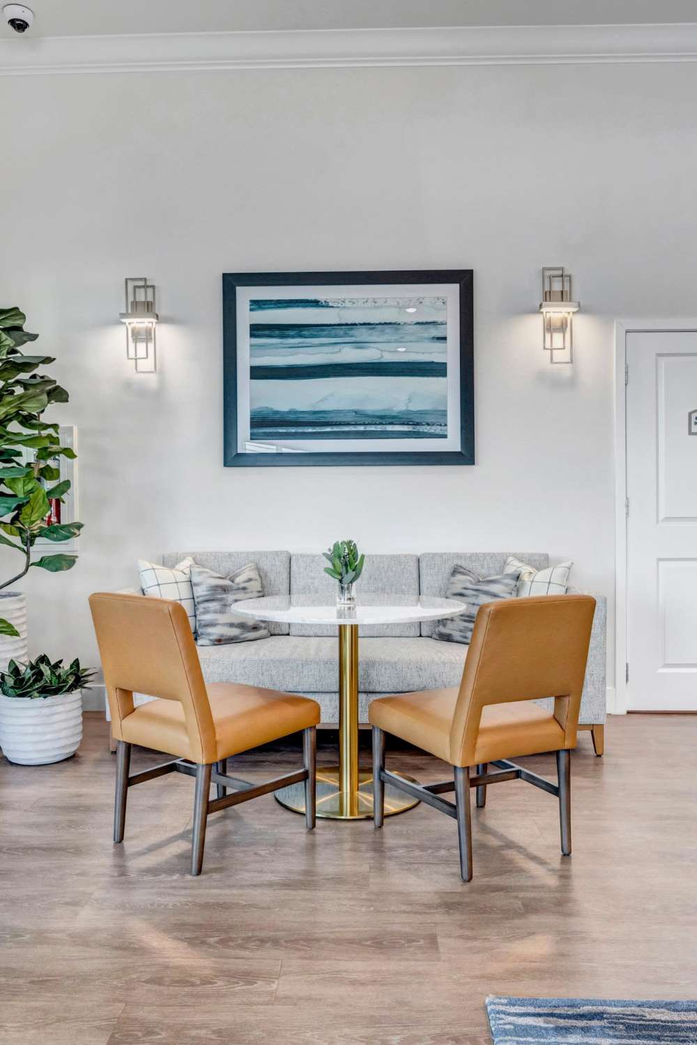 Cozy seating nook with round table and accent chairs at The Carlton At Lake Dexter in Winter Haven, Florida