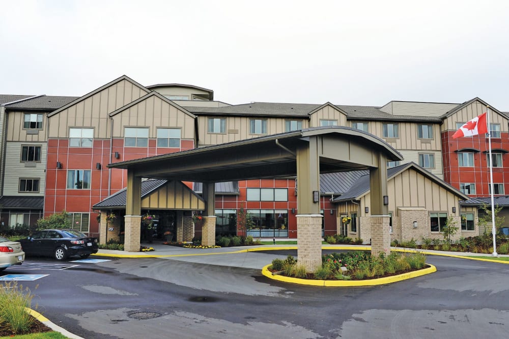 A rendering of the parking lot and main entrance at Heritage Meadows Gracious Retirement Living in Cambridge, Ontario