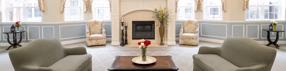 Resident lounge with fireplace at The Heritage of CyFair in Houston, Texas