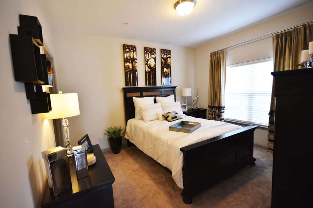 Carpeted model bedroom at Estates at McDonough Apartment Homes in McDonough, Georgia