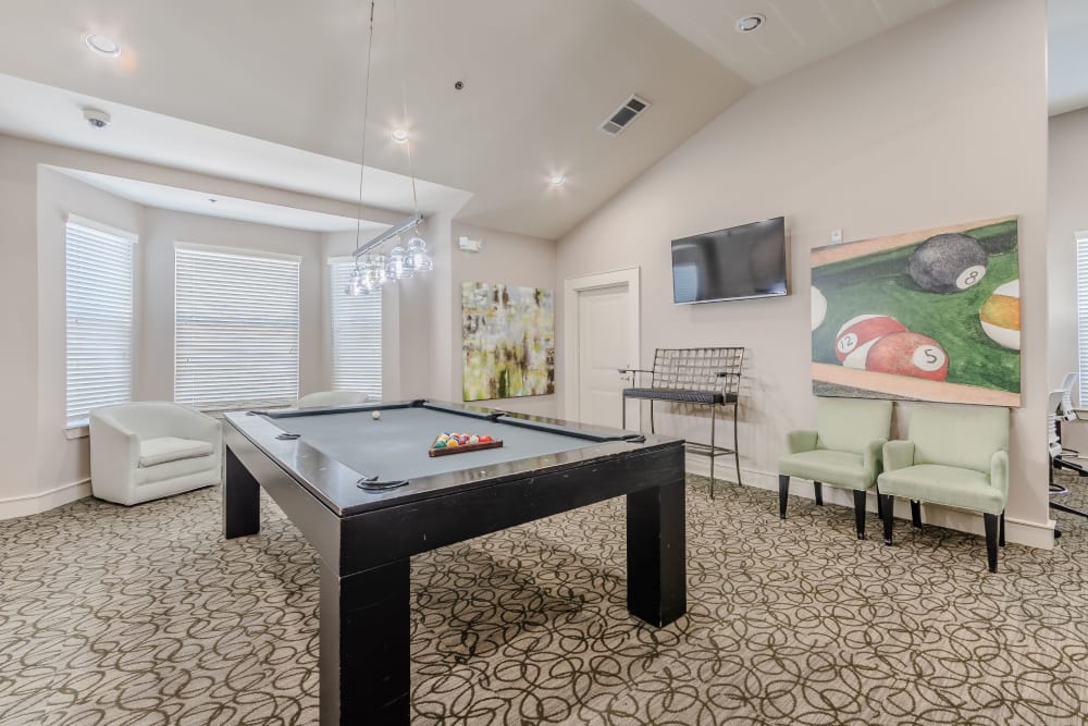 Lounge area with pool table and high ceilings at Sorrel Phillips Creek Ranch in Frisco, Texas