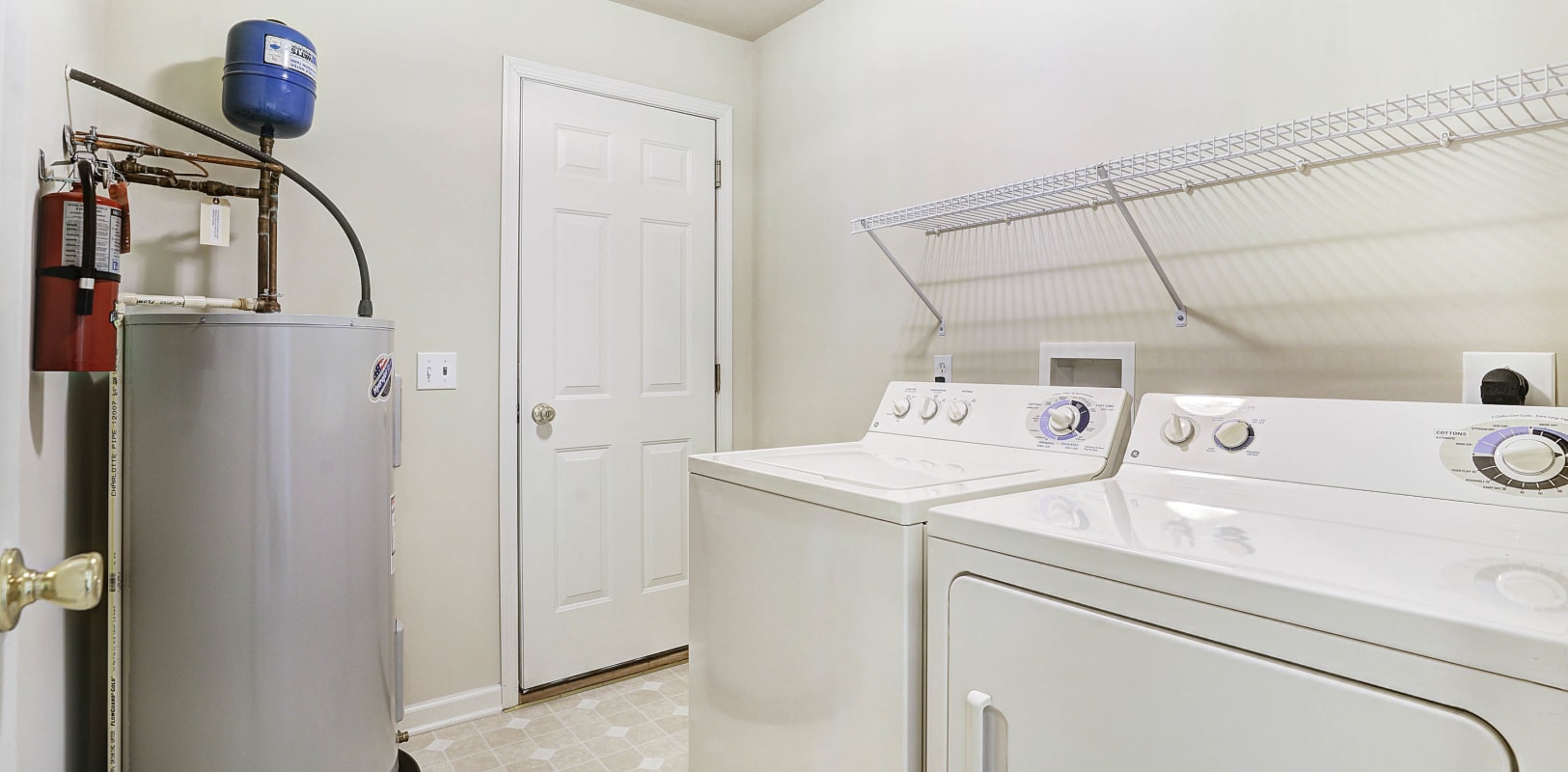 Full-size in-unit washer and dryer and water heater in a model home's laundry room at Hanover Glen in Bethlehem, Pennsylvania