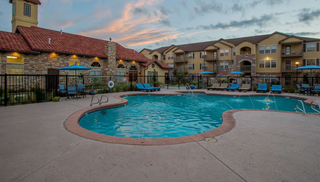 Pool with water features at Portofino Apartments in Wichita, Kansas