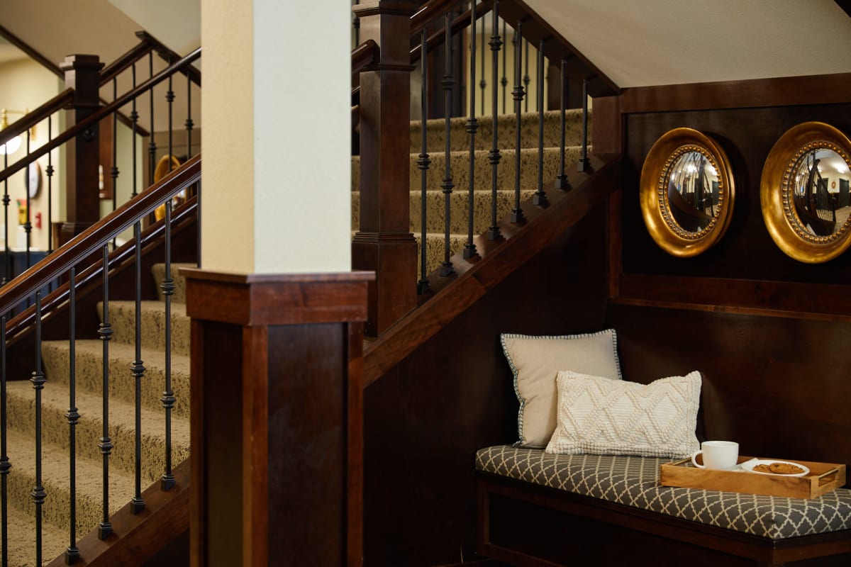 Grand staircase and seating area at Amira Choice Roseville at Lexington in Roseville, Minnesota