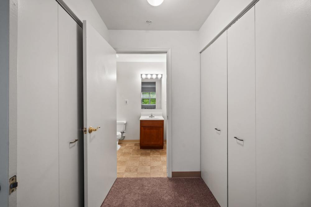hallway with large closets at Pin Oak Village in Bowie, Maryland