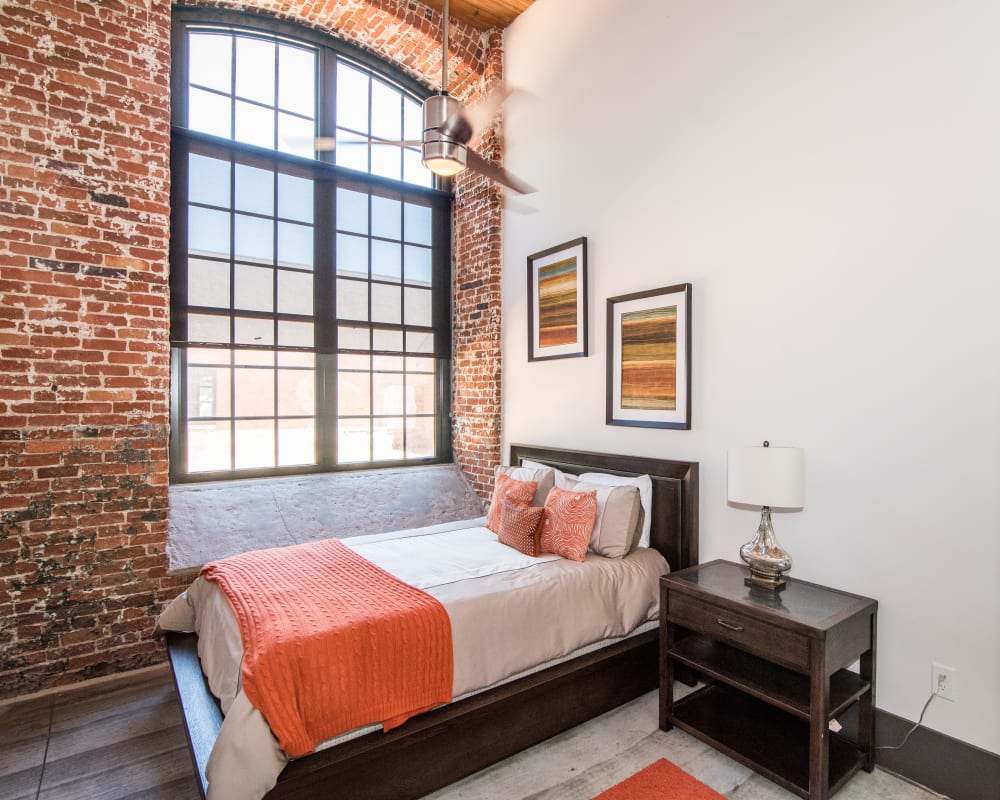 Loft style apartment with concrete style flooring at Loray Mill Lofts in Gastonia, North Carolina