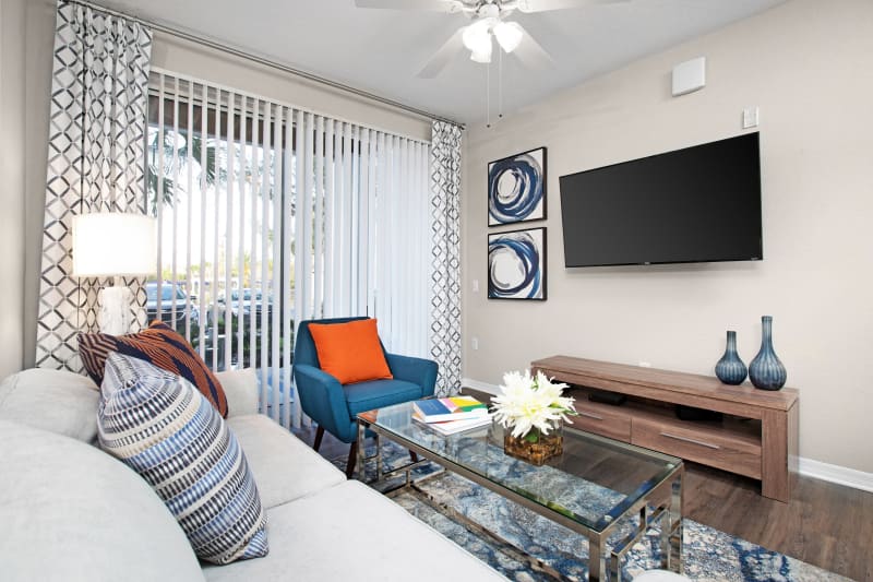 Living room with hardwood floors at The Aspect in Kissimmee, Florida