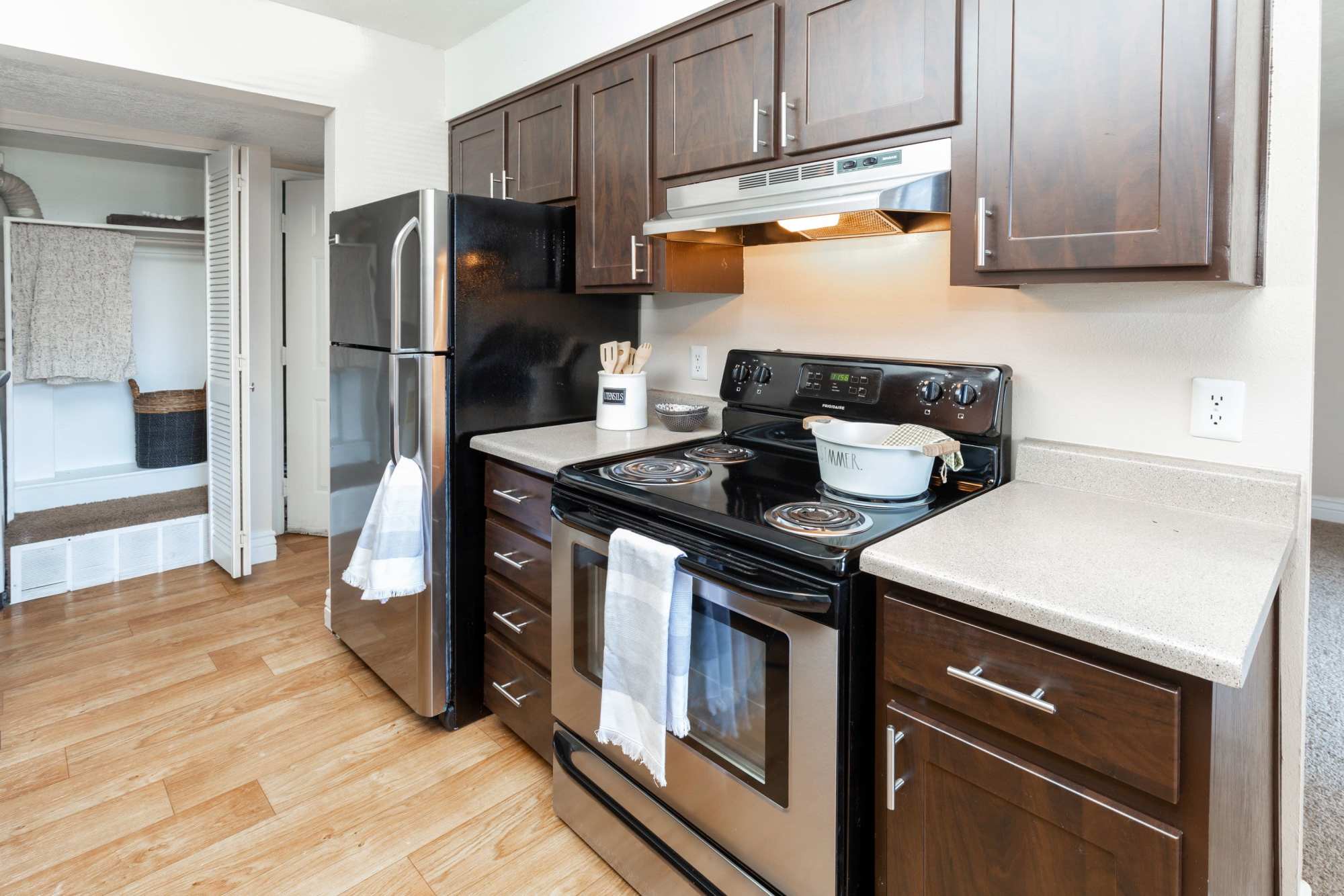 Kitchen with black appliances at Royal Ridge Apartments in Midvale, Utah