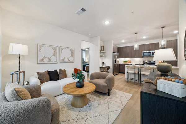 Luxury living room with seating and dining area at Dakota at Hillcroft in Houston, Texas