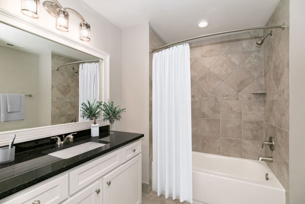 Bathroom with large vanity at Roosevelt Historic Lofts in Atlanta, Georgia