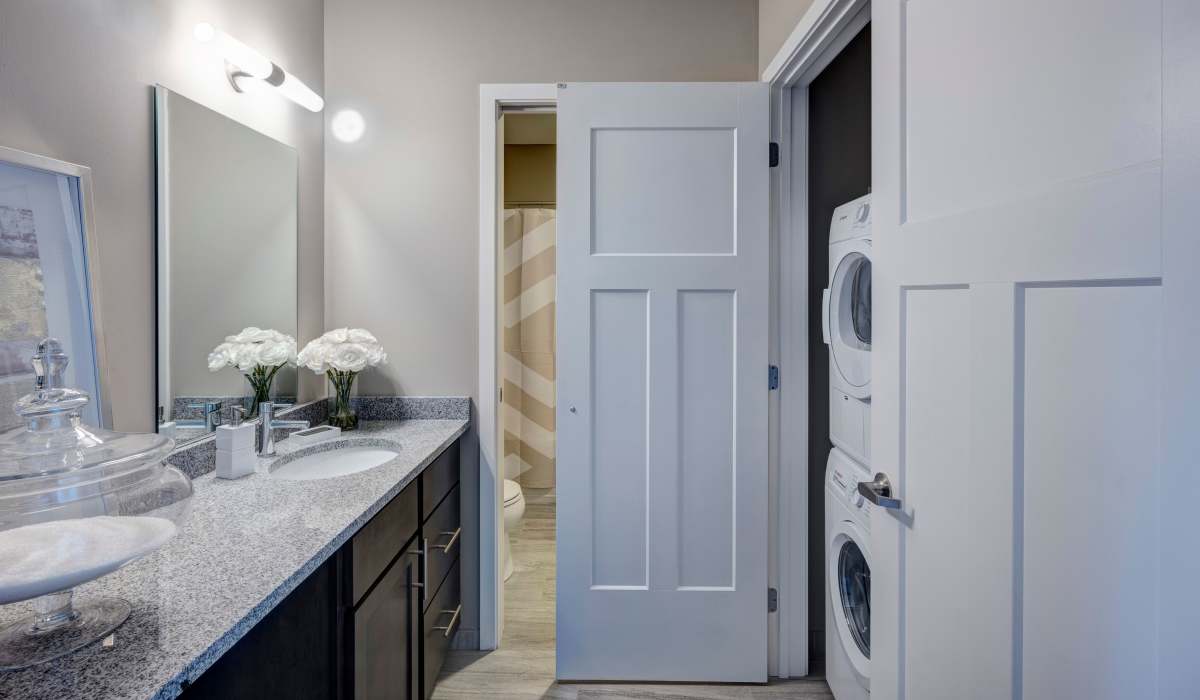 Luxury granite countertop with flowers and mirror at Commonwealth Landing Lofts in Fall River, Massachusetts