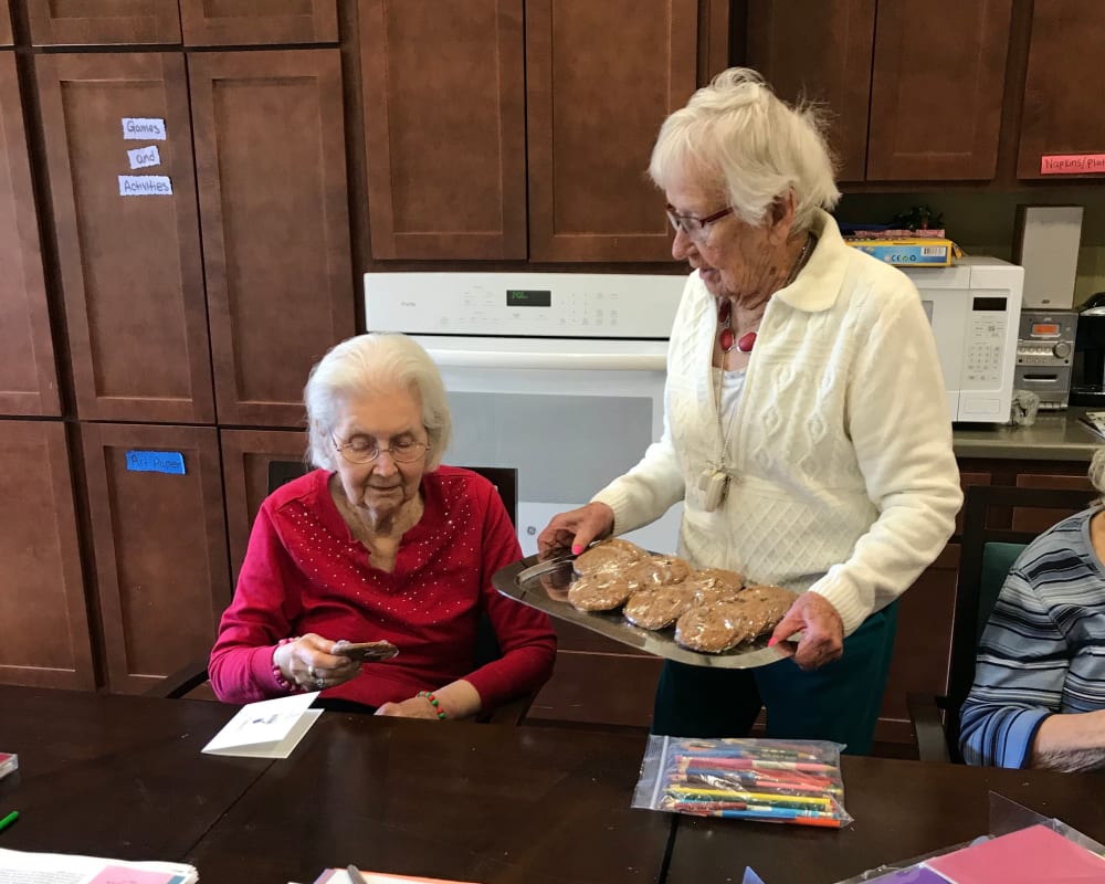 Resident sharing baking goods at Edencrest at Riverwoods in Des Moines, Iowa.